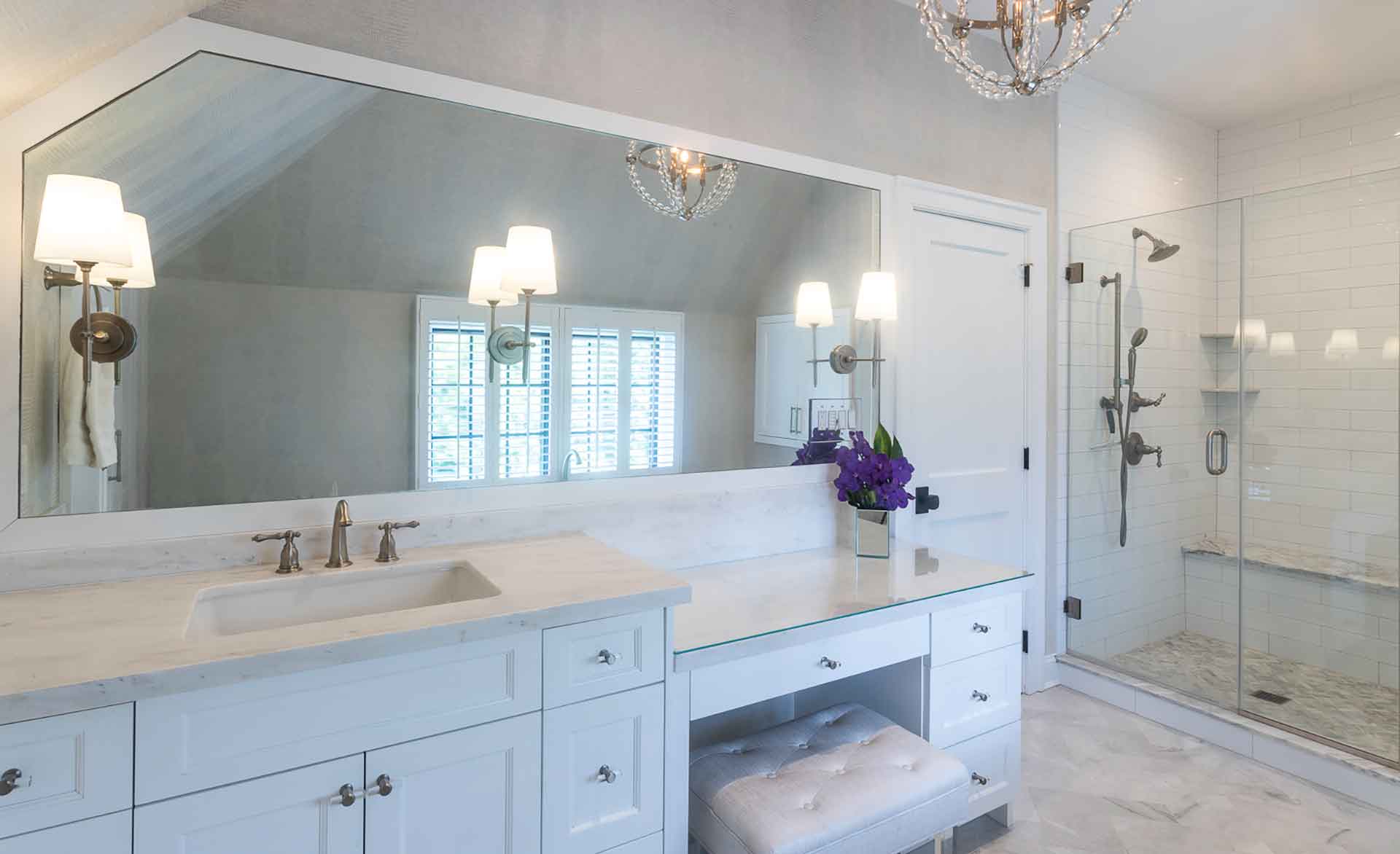 Spacious bathroom with sink, vanity and shower