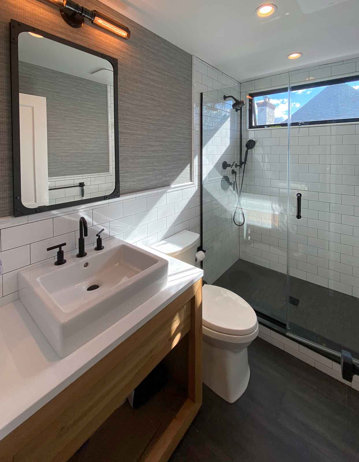 Masculine bathroom look with sink, toilet and shower