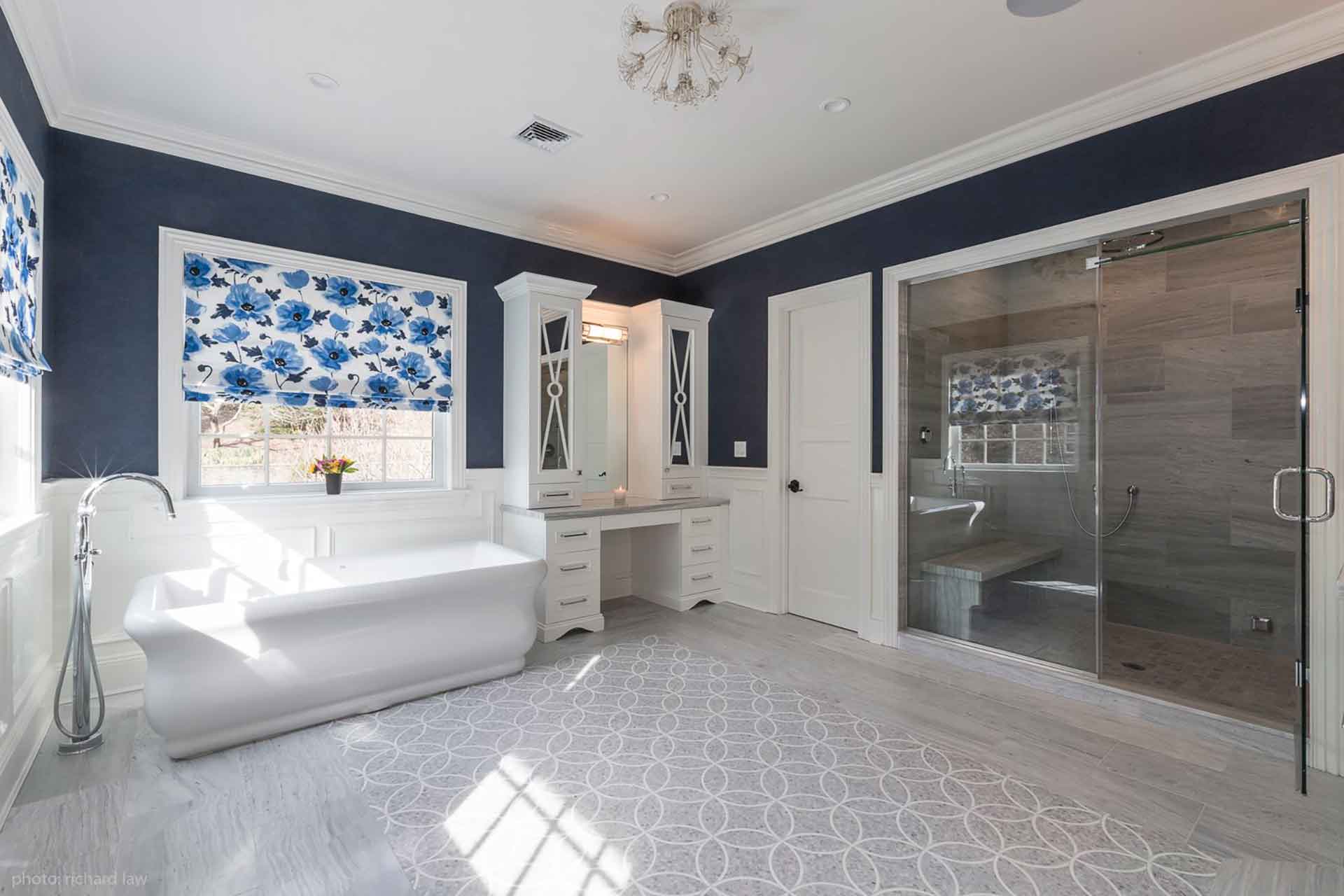 Full view of bathroom tub, vanity and shower