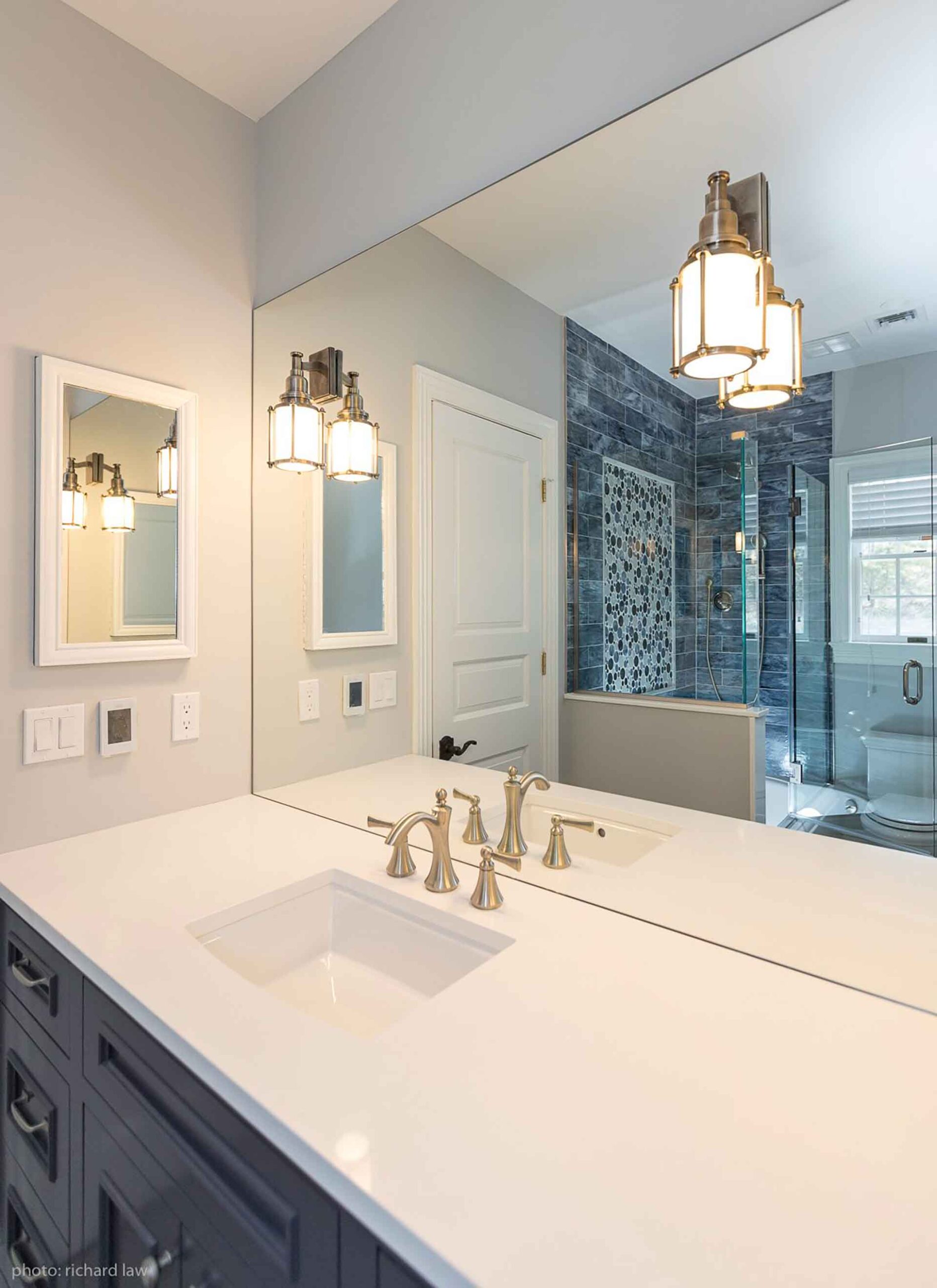 Bathroom sink mirrors with reflection of shower