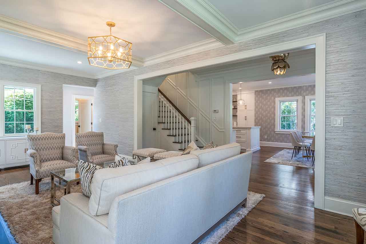 Plandome-living-room-staircase-kitchen-view